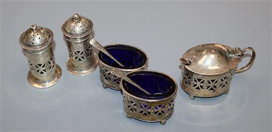 A George V five piece silver condiment, Birmingham, 1927 and two silver salt spoons.